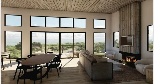 a living room with furniture tv and a large window