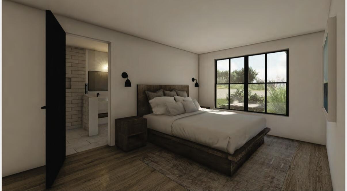 0 West End Road, Unit 1B Cuttyhunk, MA 02713 - Photo 17 of 20 a bed sitting in a spacious bedroom next to a window