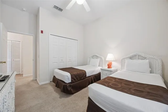 a bedroom with two beds and painted walls