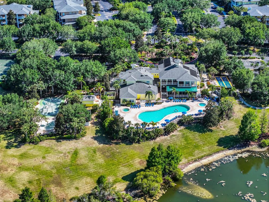 314 Lucaya Loop Davenport, FL 33897 - Photo 40 of 47 an aerial view of a house with a garden and lake view