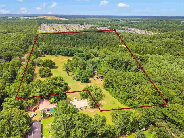 a view of a field with an ocean