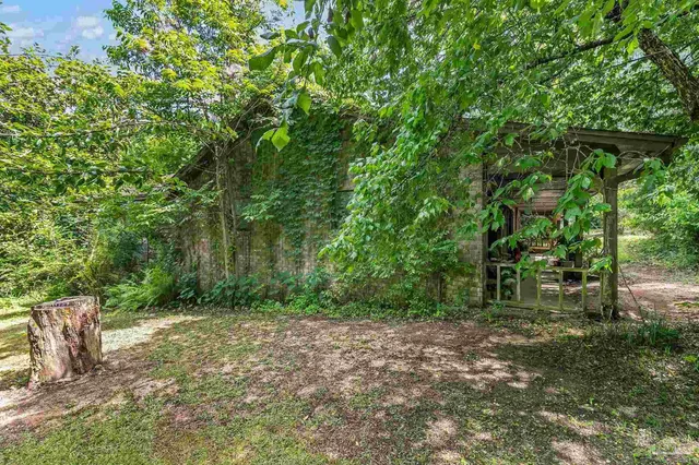 a dining room with a table and chairs