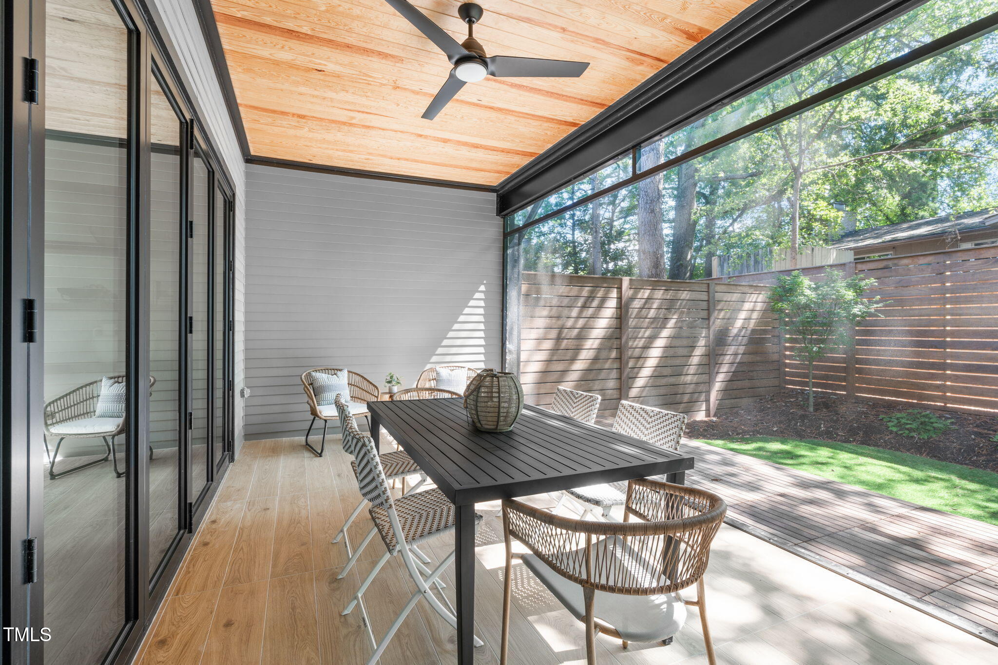 1406 Lyon Street, Unit 101 Raleigh, NC 27608 - Photo 12 of 62 a backyard of a house with table and chairs