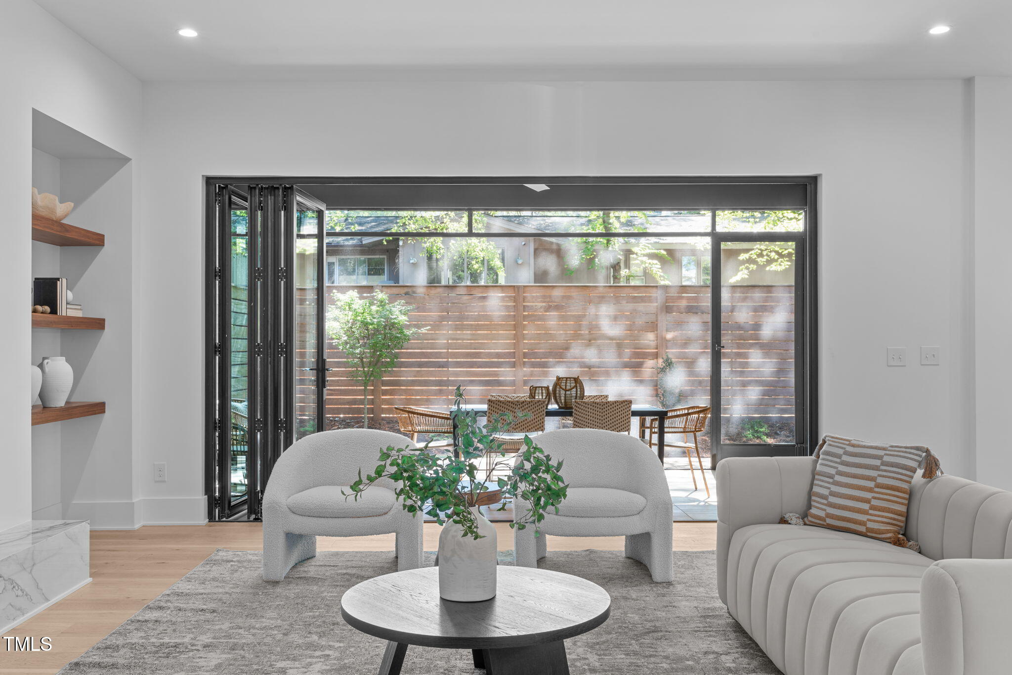 1406 Lyon Street, Unit 101 Raleigh, NC 27608 - Photo 18 of 62 a living room with furniture and a potted plant