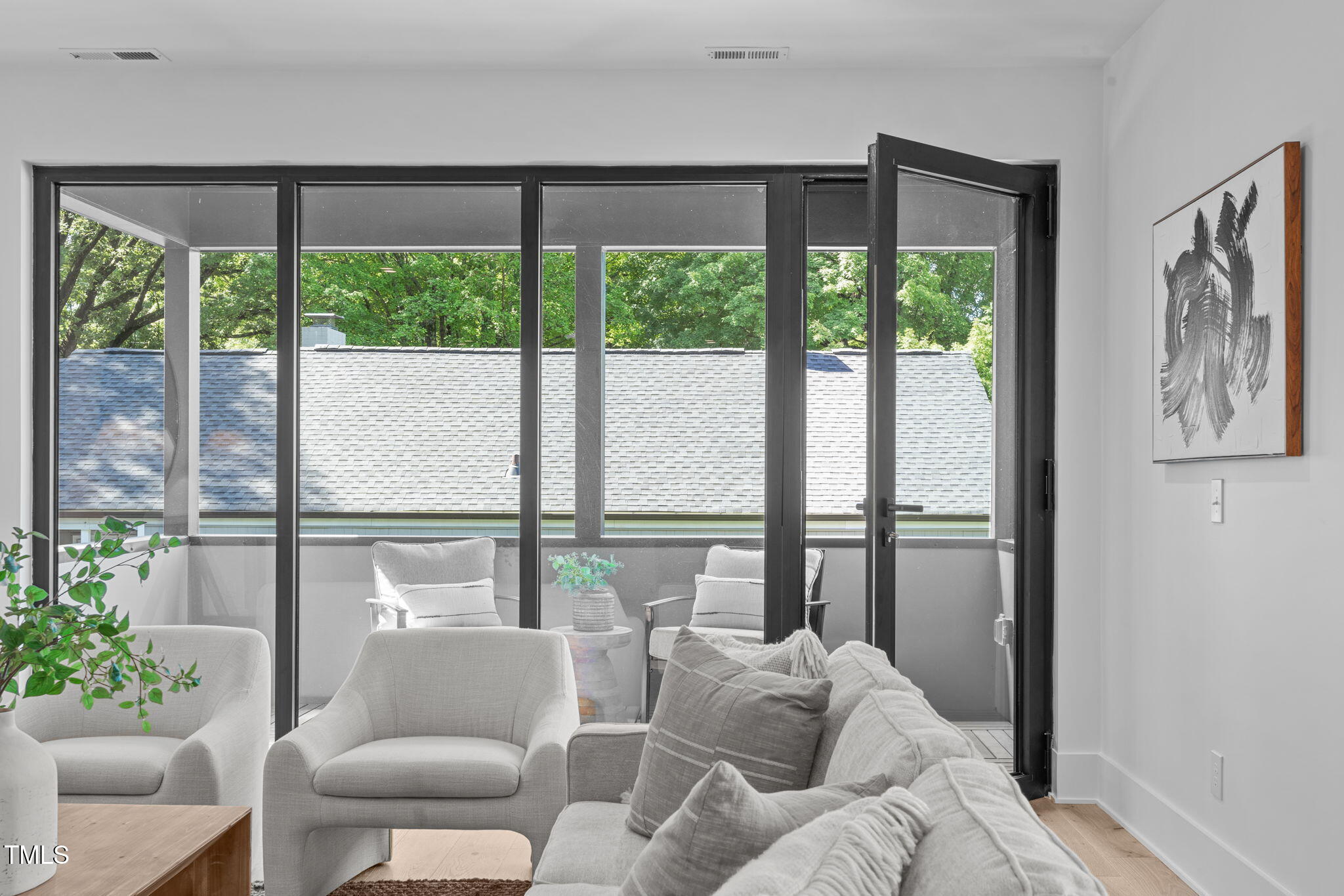 1406 Lyon Street, Unit 101 Raleigh, NC 27608 - Photo 22 of 62 a living room with furniture and a large window