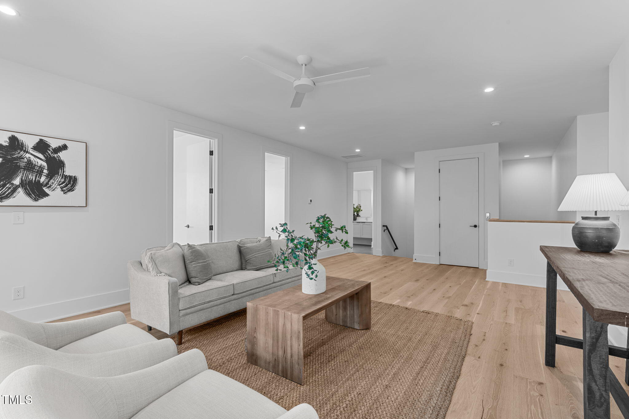 1406 Lyon Street, Unit 101 Raleigh, NC 27608 - Photo 24 of 62 a living room with furniture and a wooden floor