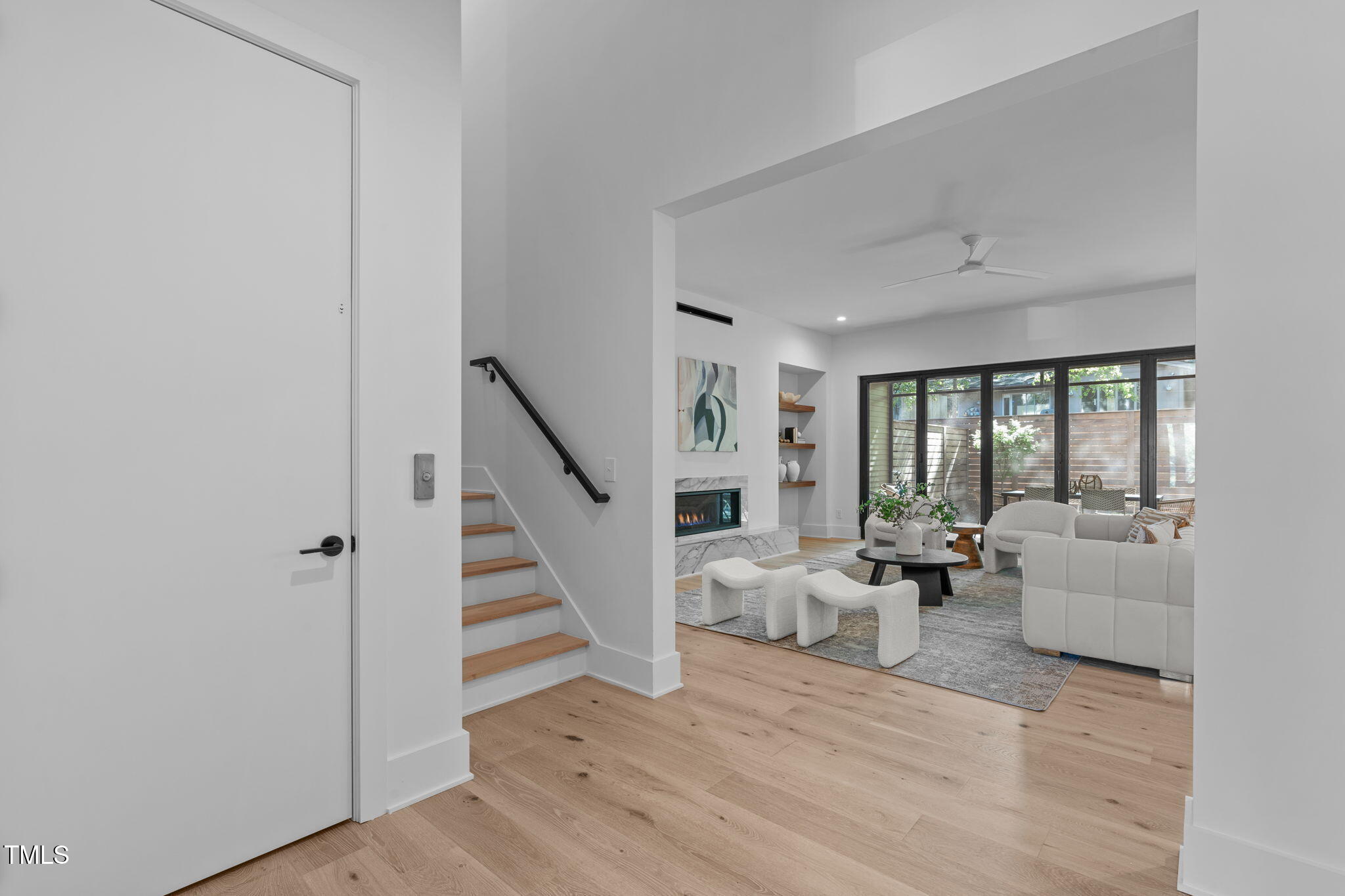 1406 Lyon Street, Unit 101 Raleigh, NC 27608 - Photo 3 of 62 a view of a livingroom with furniture wooden floor and windows