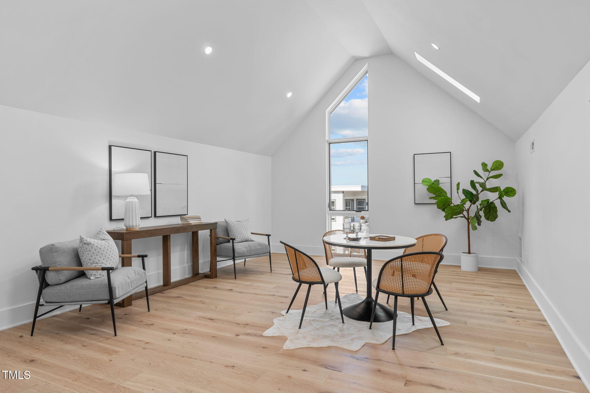 1406 Lyon Street, Unit 101 Raleigh, NC 27608 - Photo 43 of 62 a view of a dining room with furniture and wooden floor