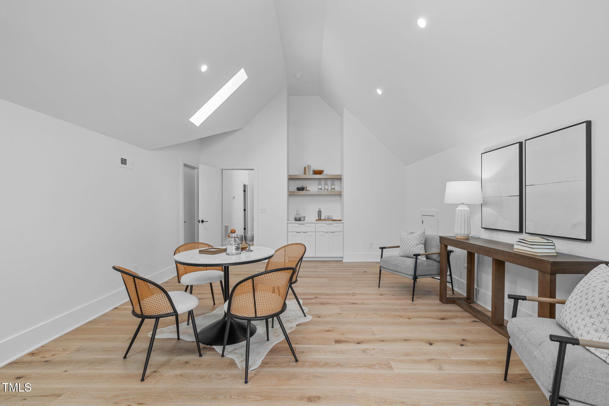 1406 Lyon Street, Unit 101 Raleigh, NC 27608 - Photo 45 of 62 a view of a dining room with furniture and wooden floor