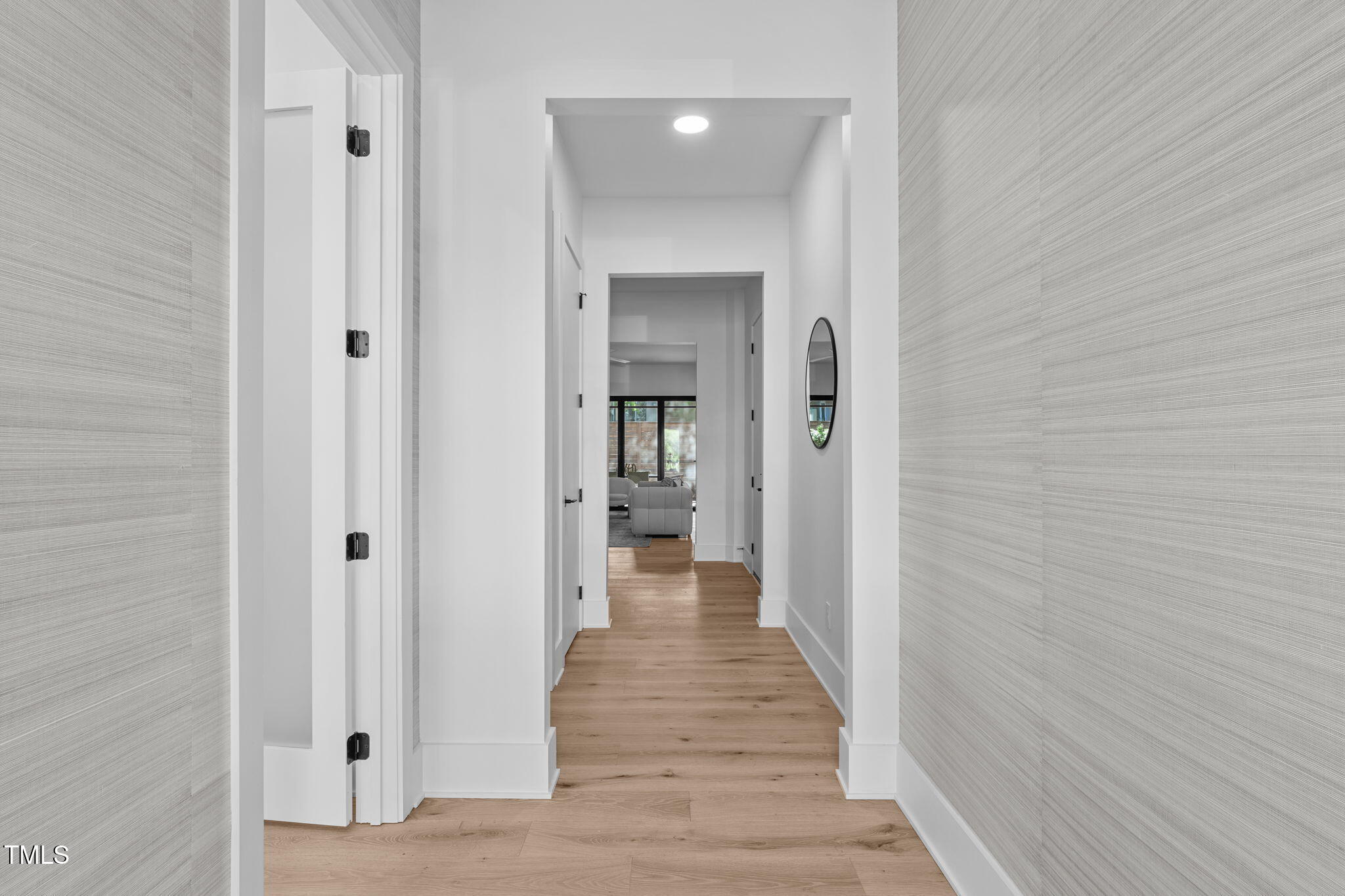 1406 Lyon Street, Unit 101 Raleigh, NC 27608 - Photo 48 of 62 a view of a hallway with wooden floor