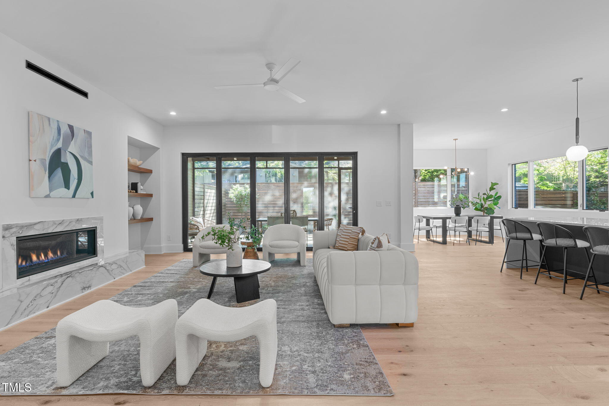 1406 Lyon Street, Unit 101 Raleigh, NC 27608 - Photo 4 of 62 a living room with furniture and a fireplace