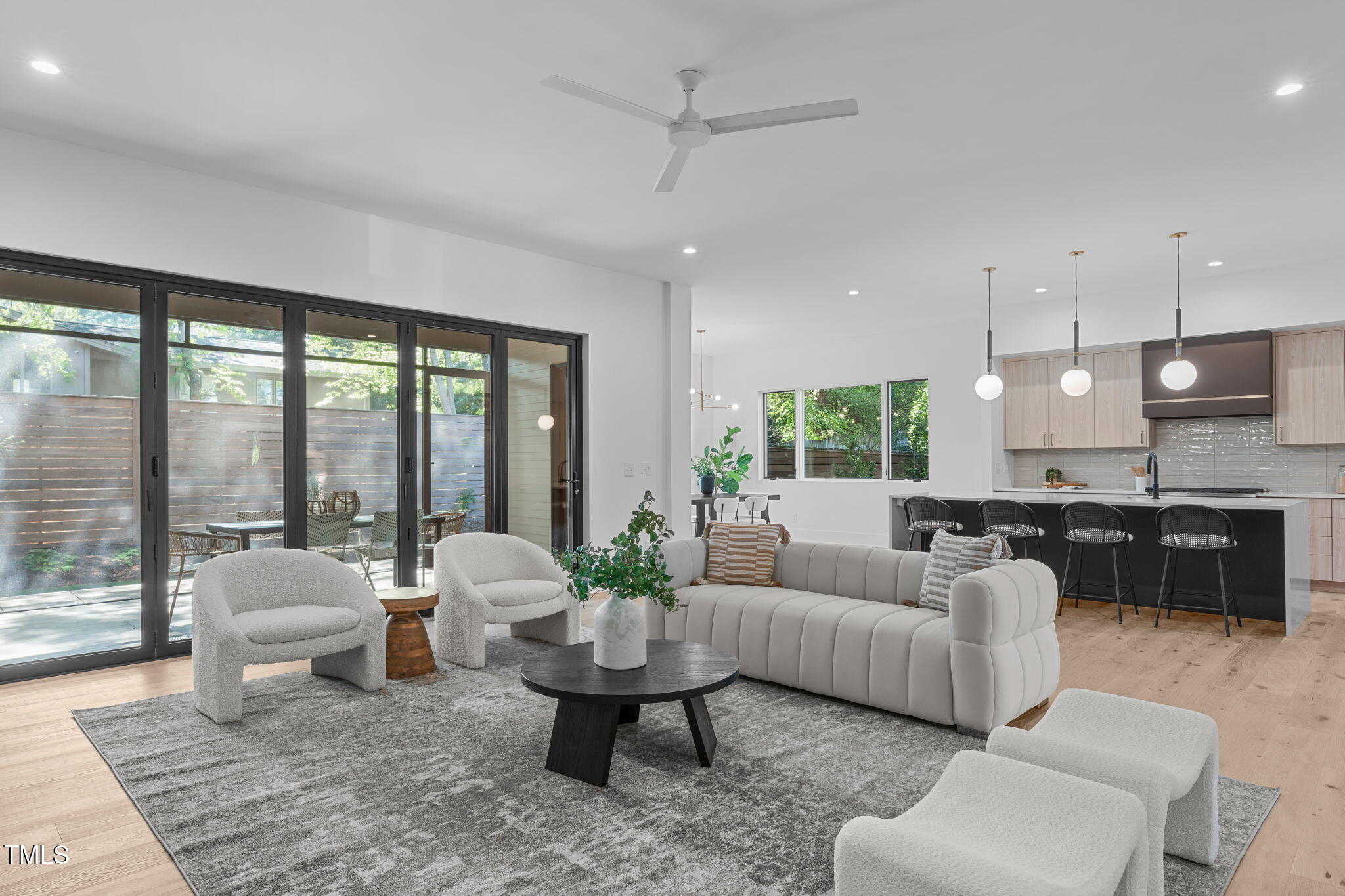 1406 Lyon Street, Unit 101 Raleigh, NC 27608 - Photo 5 of 62 a living room with furniture and a large window