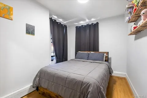 a bedroom with a bed and a mirror