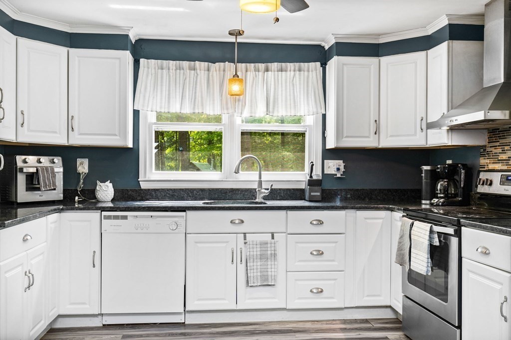 3 Betty Spring Road Freetown, MA 02717 - Photo 8 of 34 a kitchen with granite countertop a sink window and cabinets