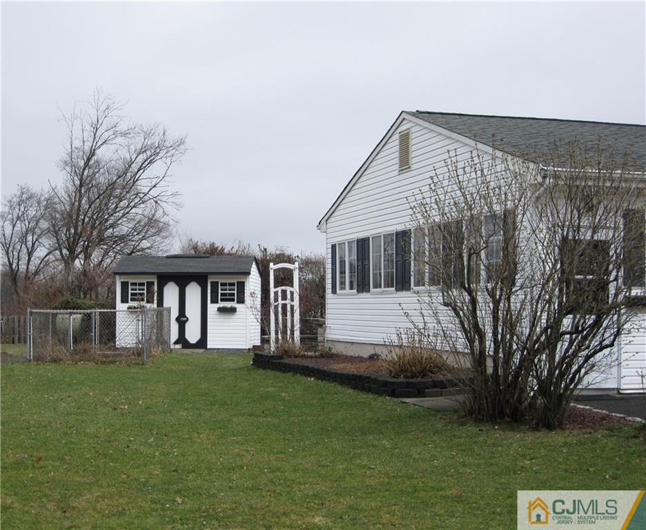 110 Princeton Road Old Bridge, NJ 08859 - Photo 2 of 19 a front view of a house with a garden