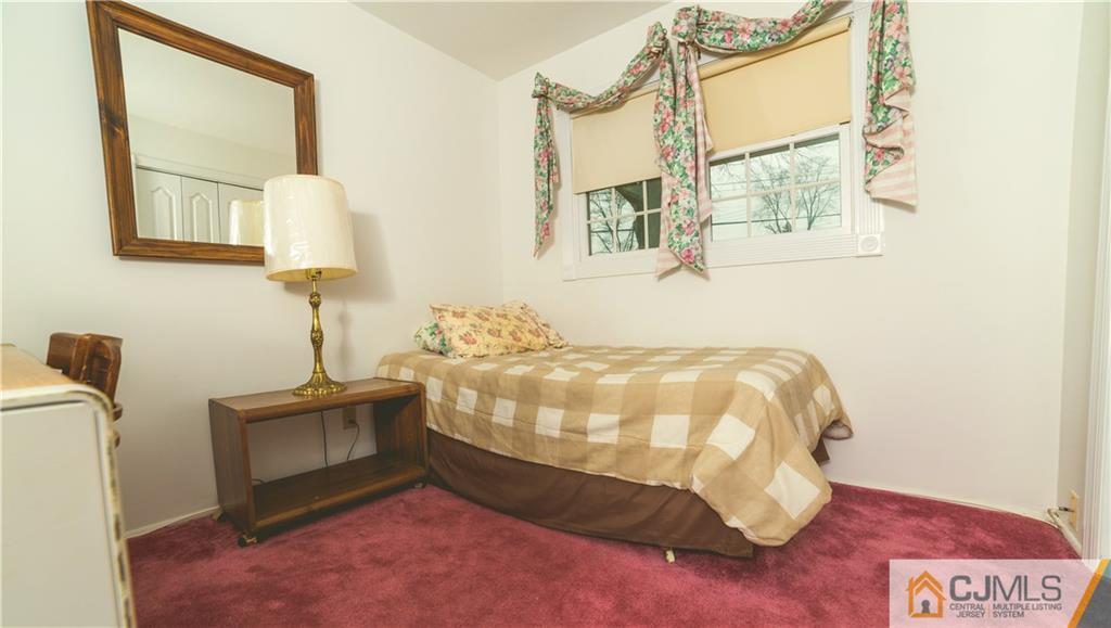 110 Princeton Road Old Bridge, NJ 08859 - Photo 15 of 19 a bedroom with a bed and a window