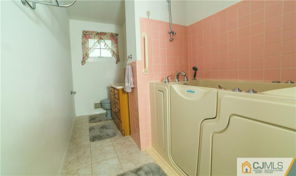 110 Princeton Road Old Bridge, NJ 08859 - Photo 16 of 19 a utility room with dryer and washer