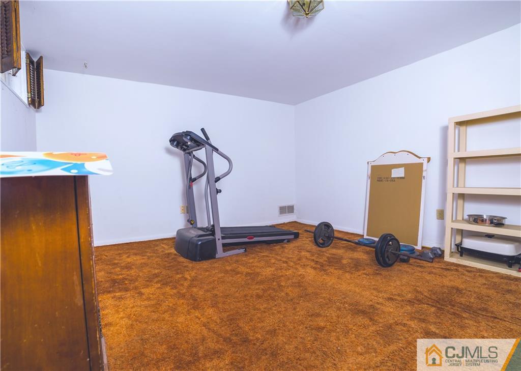 110 Princeton Road Old Bridge, NJ 08859 - Photo 17 of 19 a view of a room with gym equipment