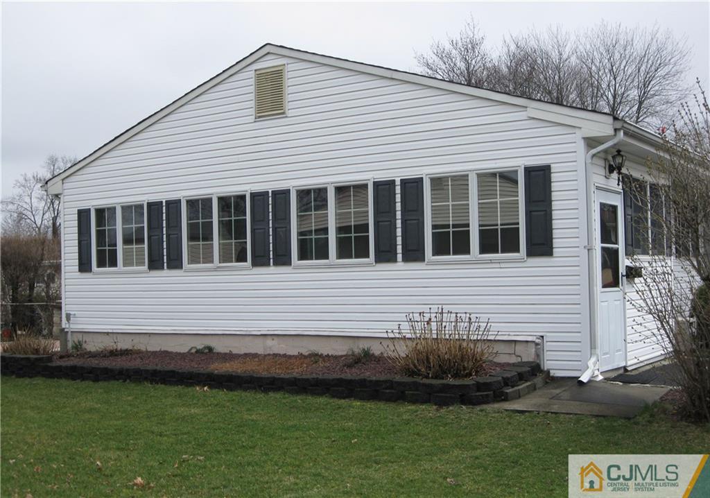 110 Princeton Road Old Bridge, NJ 08859 - Photo 3 of 19 a front view of a house with a garden
