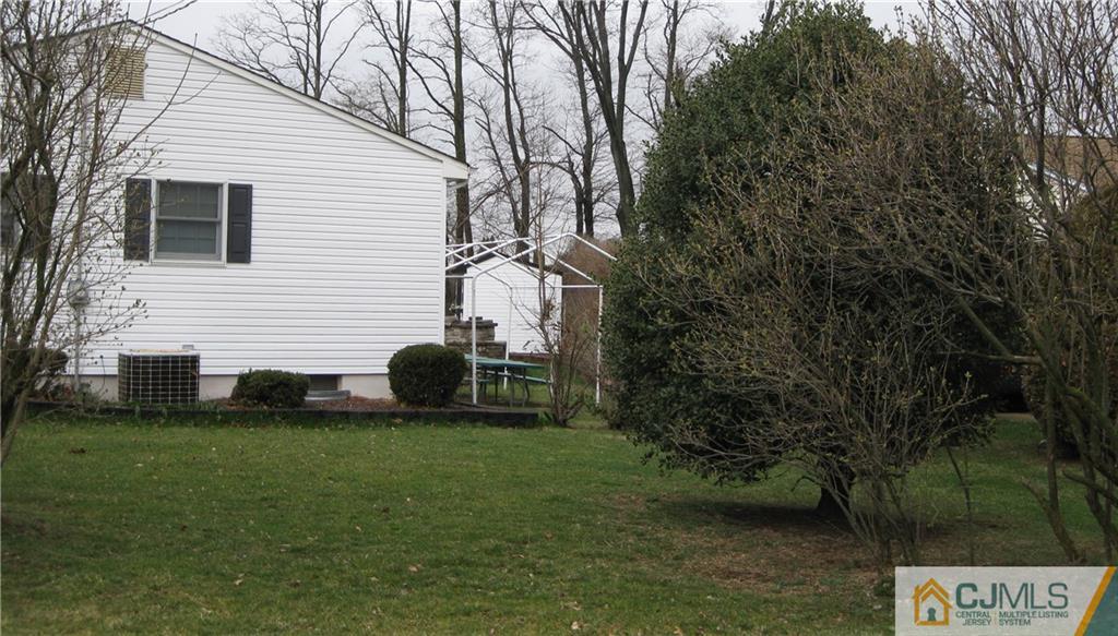 110 Princeton Road Old Bridge, NJ 08859 - Photo 8 of 19 a view of a white house with a yard