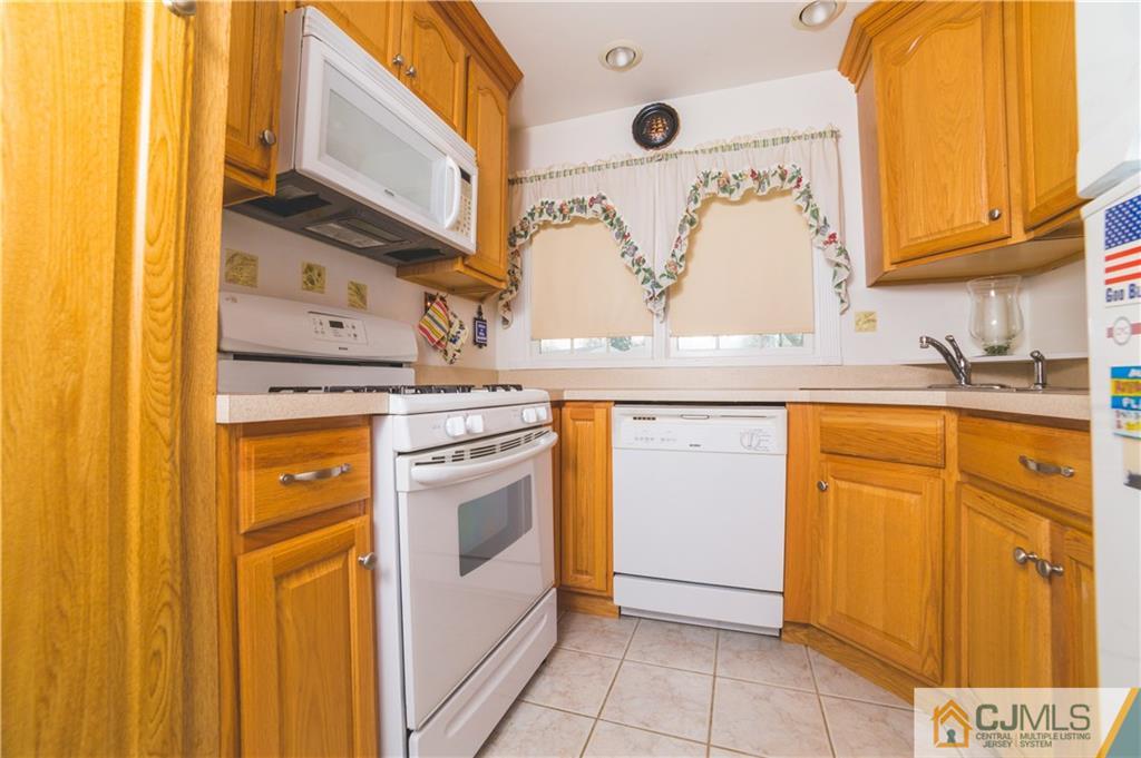 110 Princeton Road Old Bridge, NJ 08859 - Photo 9 of 19 a kitchen with stainless steel appliances granite countertop a sink and cabinets