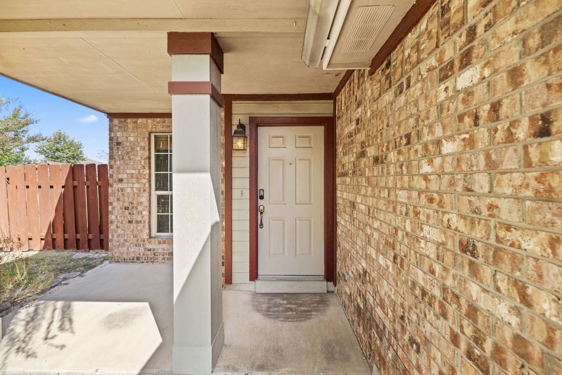 413 Clarks Way Hutto, TX 78634 - Photo 1 of 34 Entrance to property with brick siding and covered porch