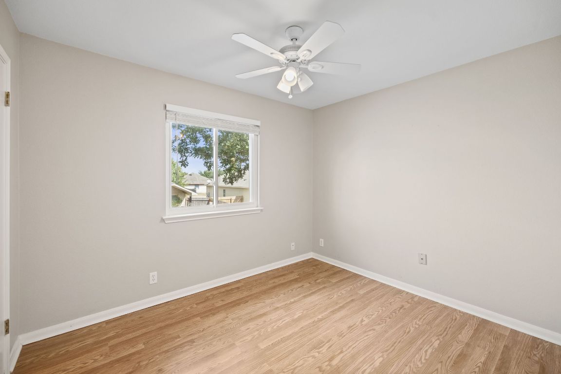 413 Clarks Way Hutto, TX 78634 - Photo 20 of 34 Spare room featuring light wood-style floors and a ceiling fan
