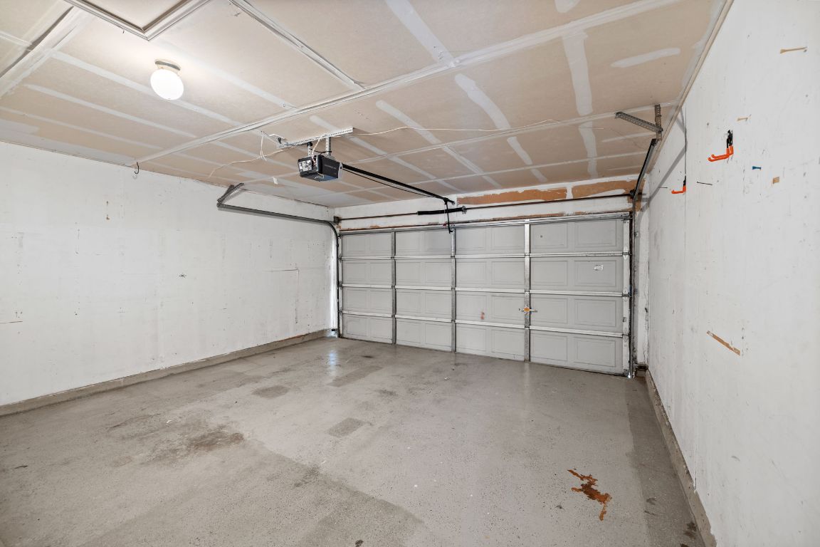 413 Clarks Way Hutto, TX 78634 - Photo 31 of 34 Garage with a garage door opener