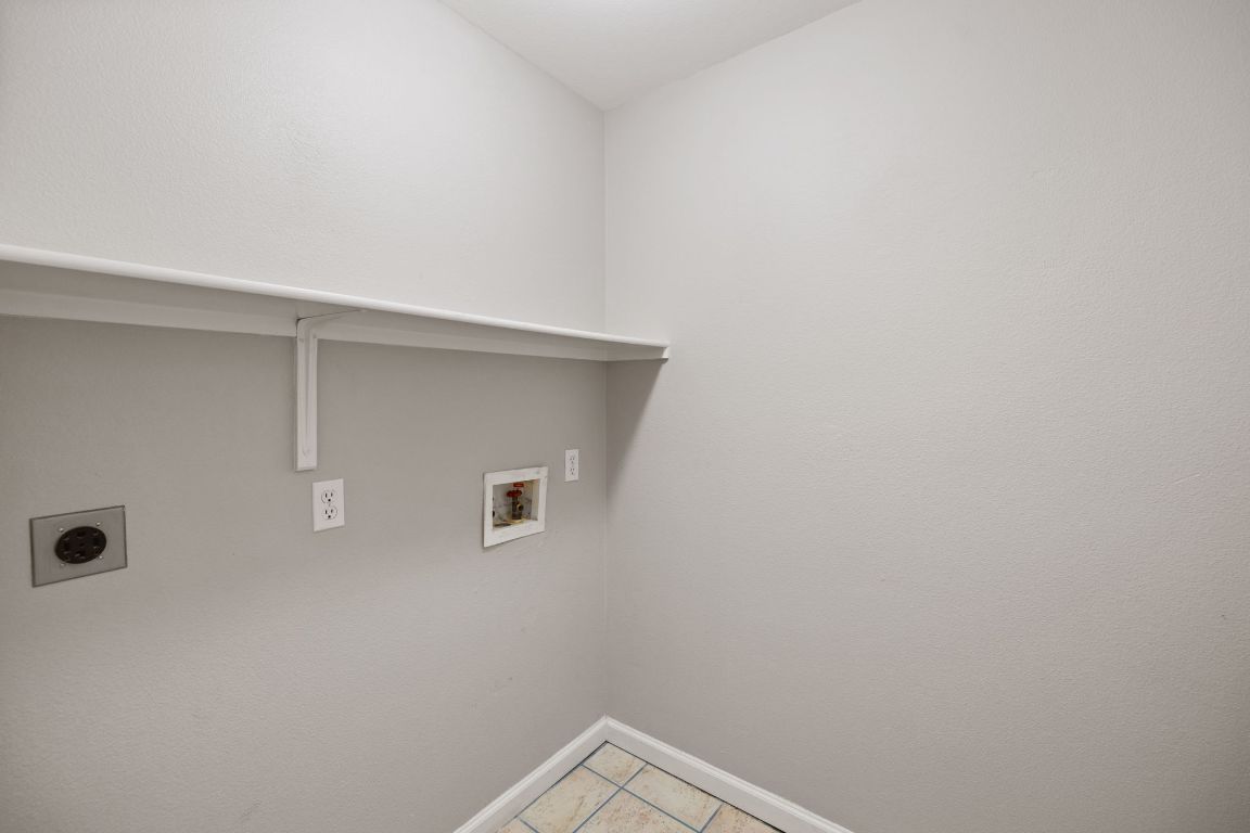 413 Clarks Way Hutto, TX 78634 - Photo 6 of 34 Laundry room featuring light tile patterned flooring, washer hookup, and electric dryer hookup