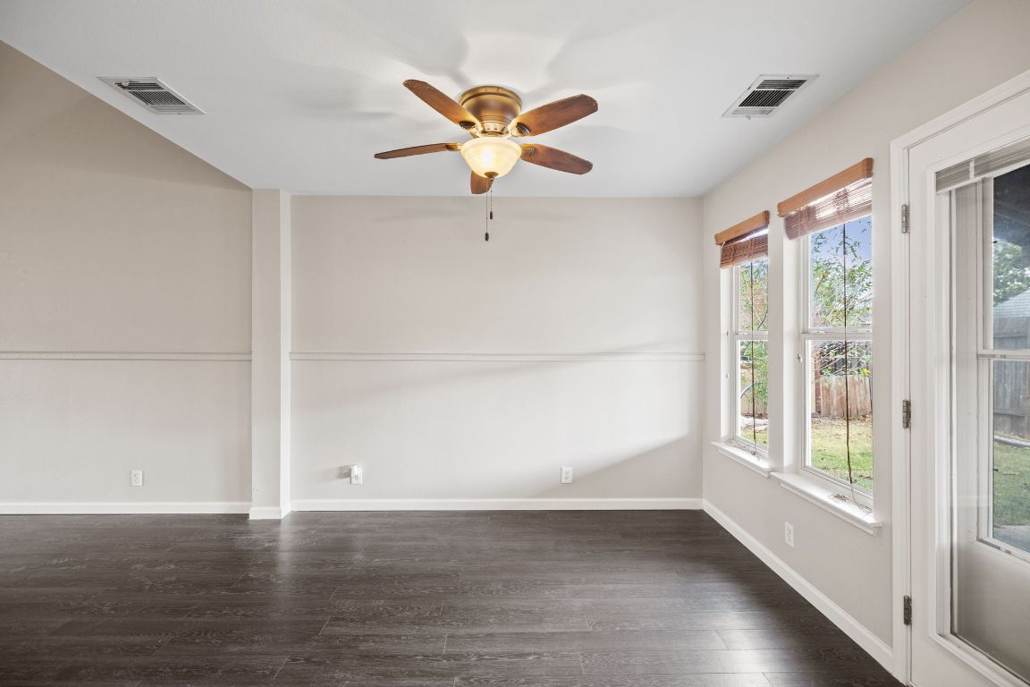 413 Clarks Way Hutto, TX 78634 - Photo 9 of 34 Living room featuring dark wood-style flooring and a ceiling fan