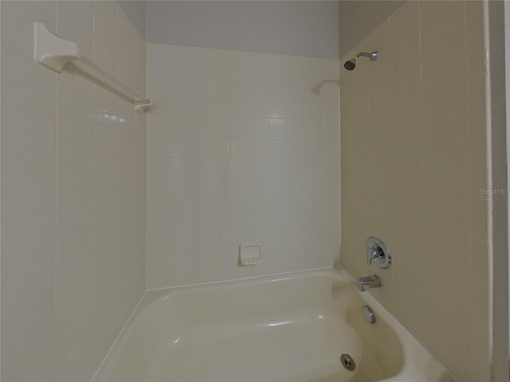 Undisclosed Address Land O Lakes, FL 34638 - Photo 13 of 18 a bathroom with a bathtub