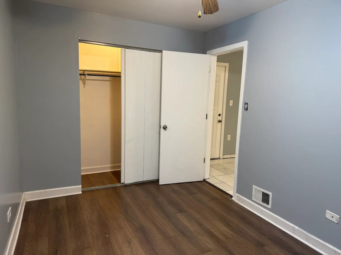 3033 South Kenneth Avenue Chicago, IL 60623 - Photo 14 of 43 an empty room with wooden floor and a window