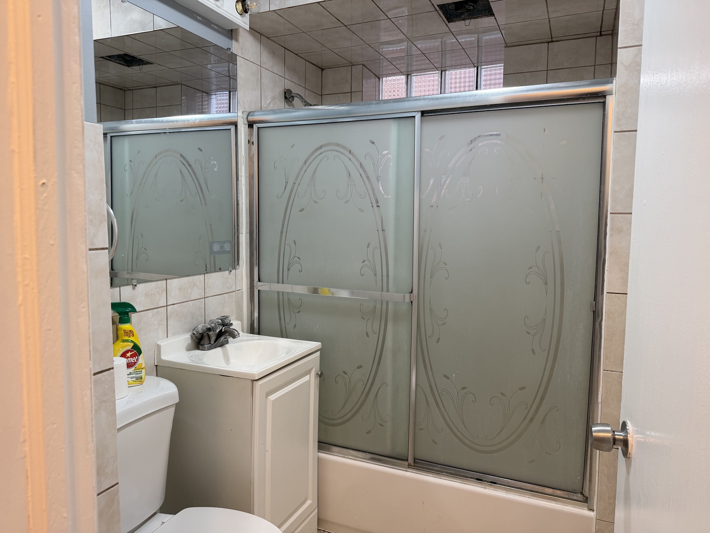3033 South Kenneth Avenue Chicago, IL 60623 - Photo 16 of 43 a bathroom with a sink a toilet and shower