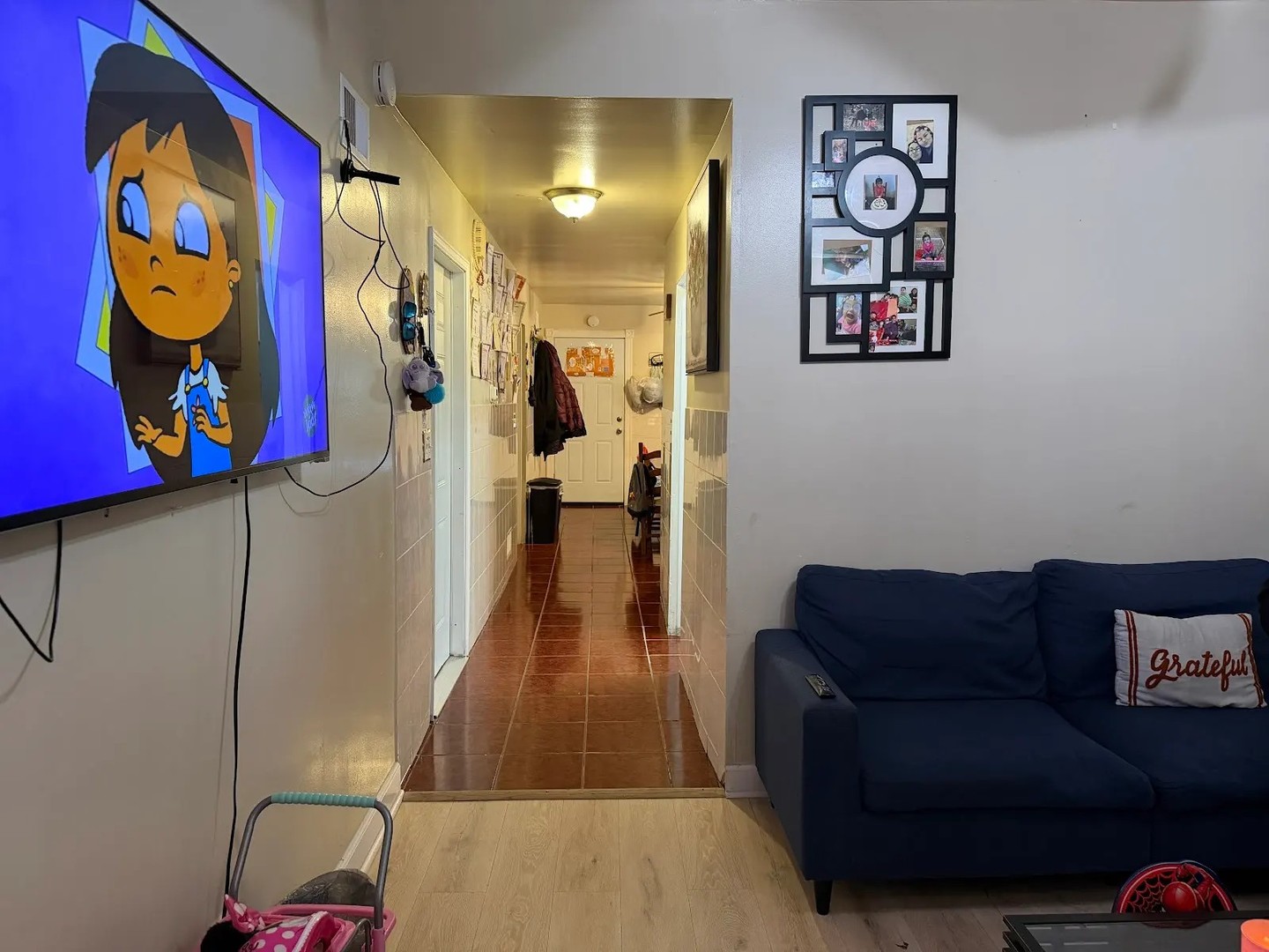 3033 South Kenneth Avenue Chicago, IL 60623 - Photo 27 of 43 a living room with furniture and wall painting
