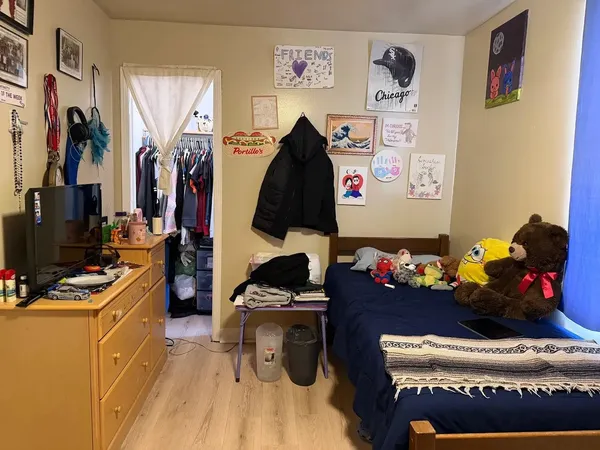 a bedroom with a bed and a couch