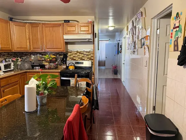 a kitchen with a sink and a refrigerator