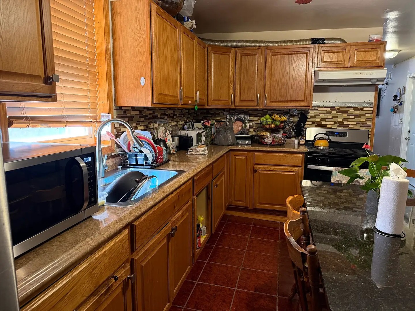 3033 South Kenneth Avenue Chicago, IL 60623 - Photo 36 of 43 a kitchen with a sink appliances cabinets and a window