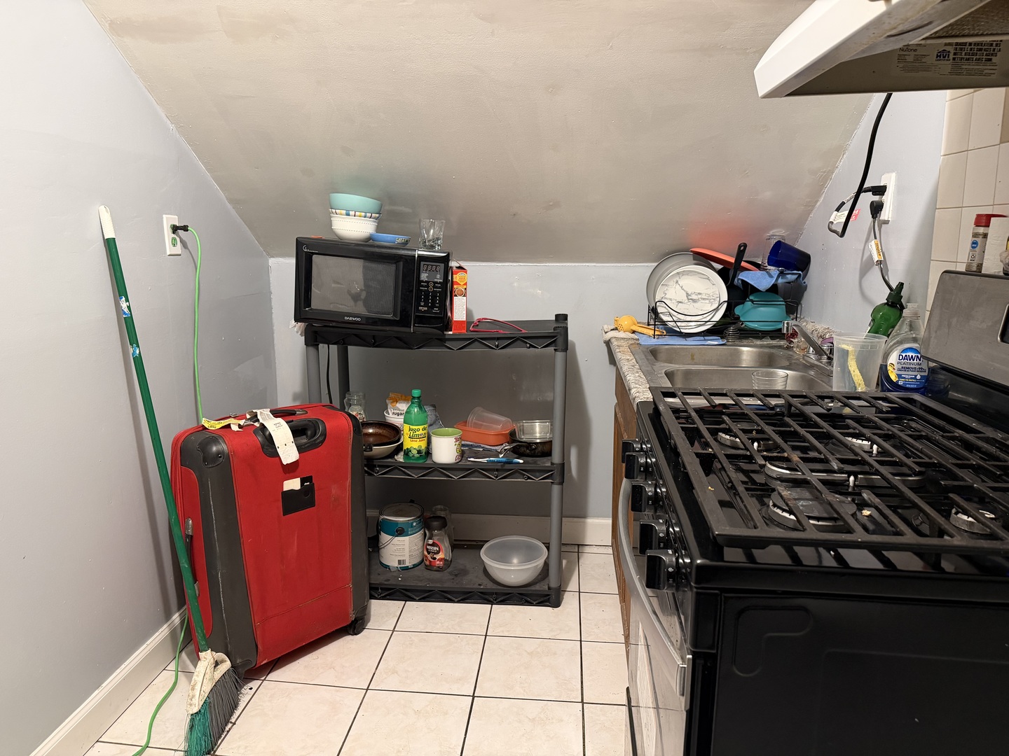 3033 South Kenneth Avenue Chicago, IL 60623 - Photo 38 of 43 a kitchen with microwave a stove and cabinets