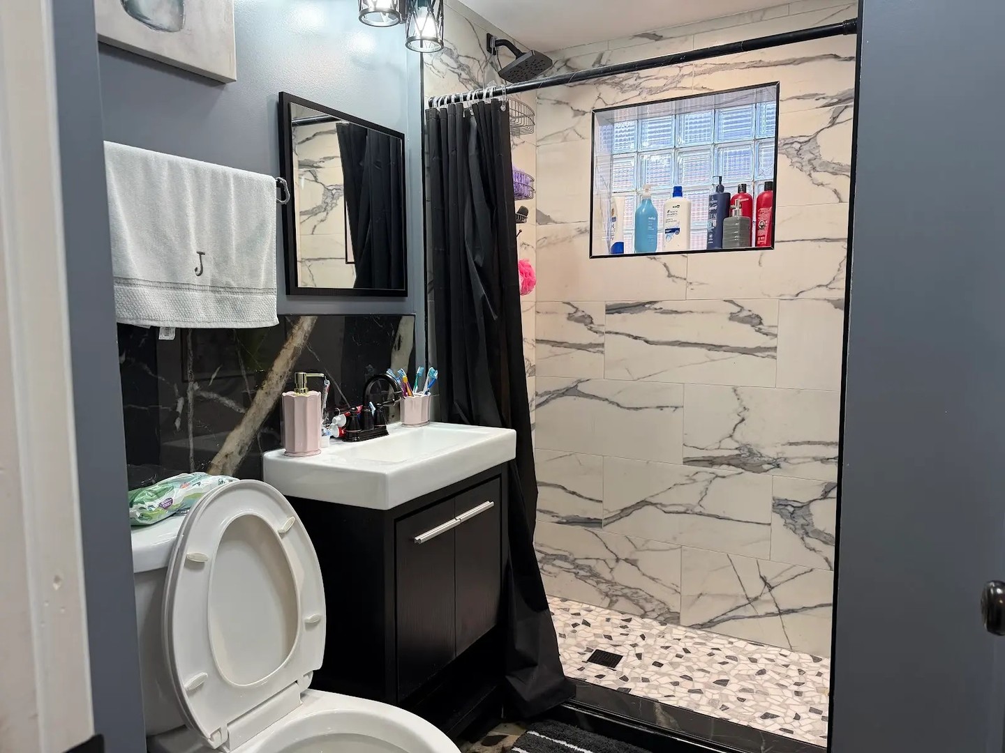 3033 South Kenneth Avenue Chicago, IL 60623 - Photo 39 of 43 a bathroom with a sink toilet and shower