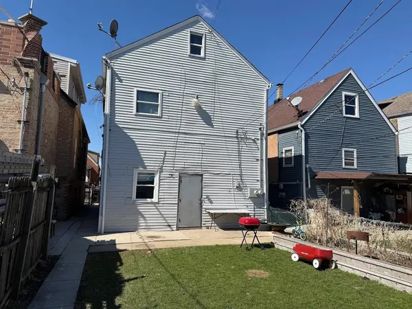 a house view with a backyard space