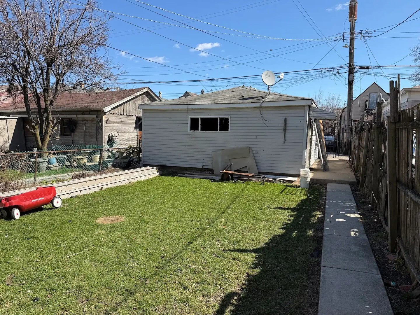 3033 South Kenneth Avenue Chicago, IL 60623 - Photo 43 of 43 a house view with a backyard space