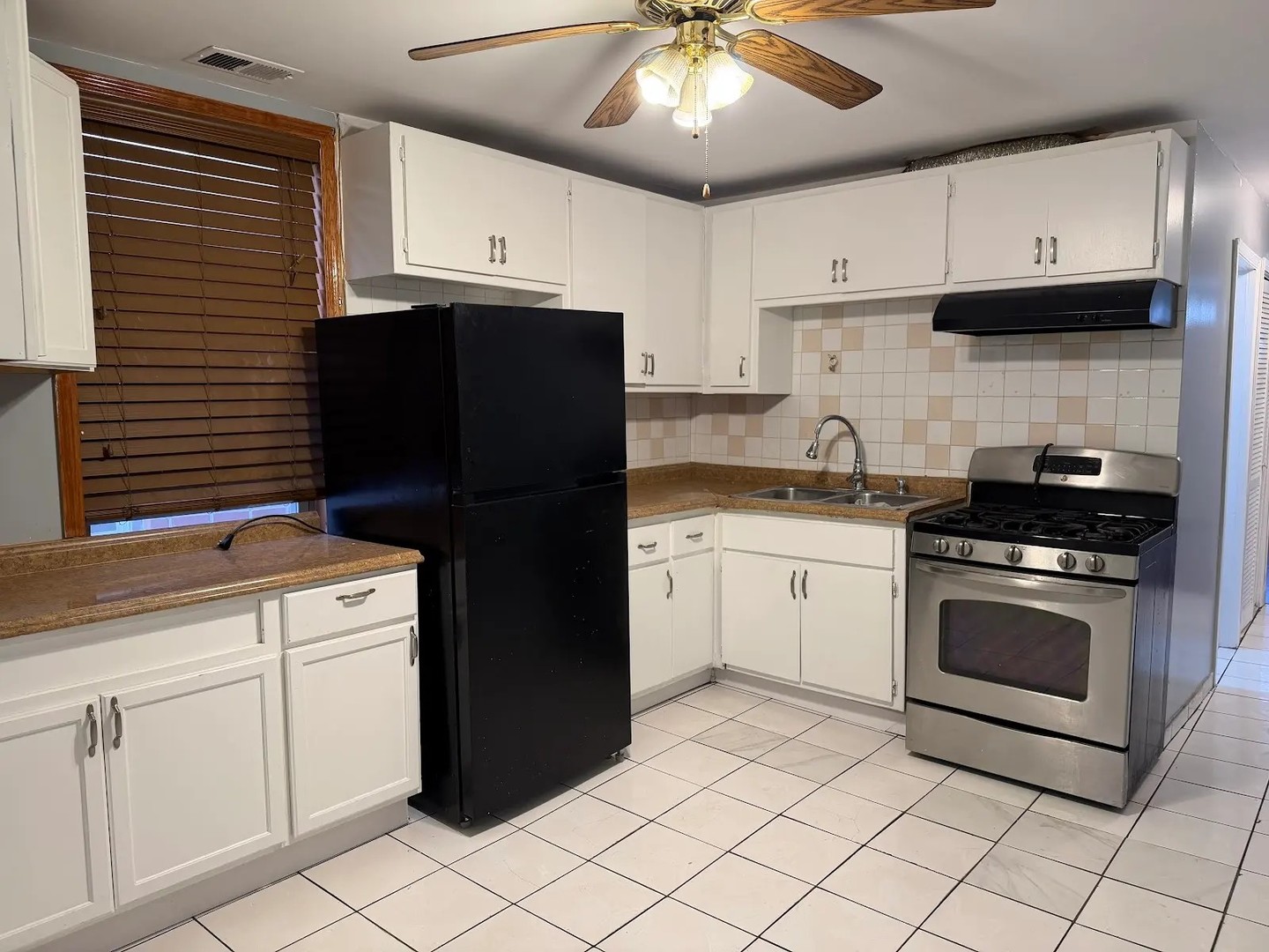 3033 South Kenneth Avenue Chicago, IL 60623 - Photo 9 of 43 a kitchen with a cabinets and appliances