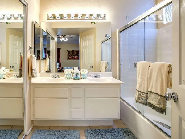 a bathroom with a sink and mirror