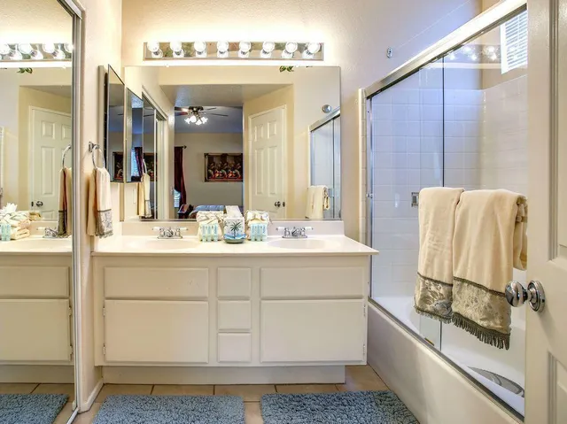a bathroom with a sink and mirror