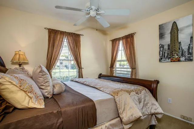 a bedroom with a bed and window