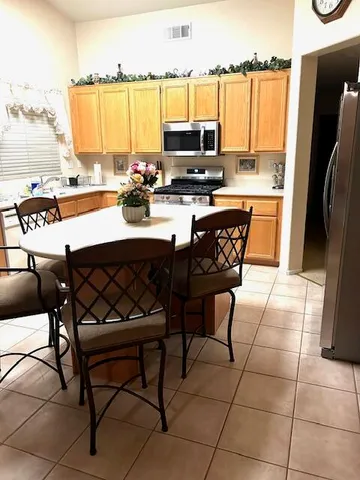 a kitchen with a window a sink and a refrigerator