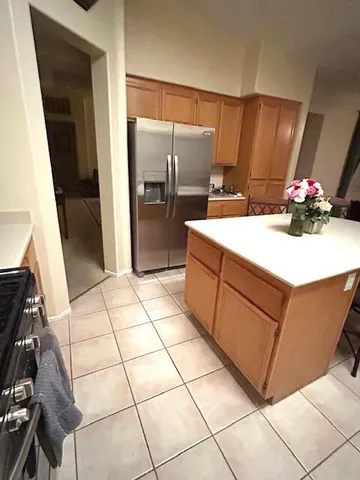 a kitchen with a sink and refrigerator