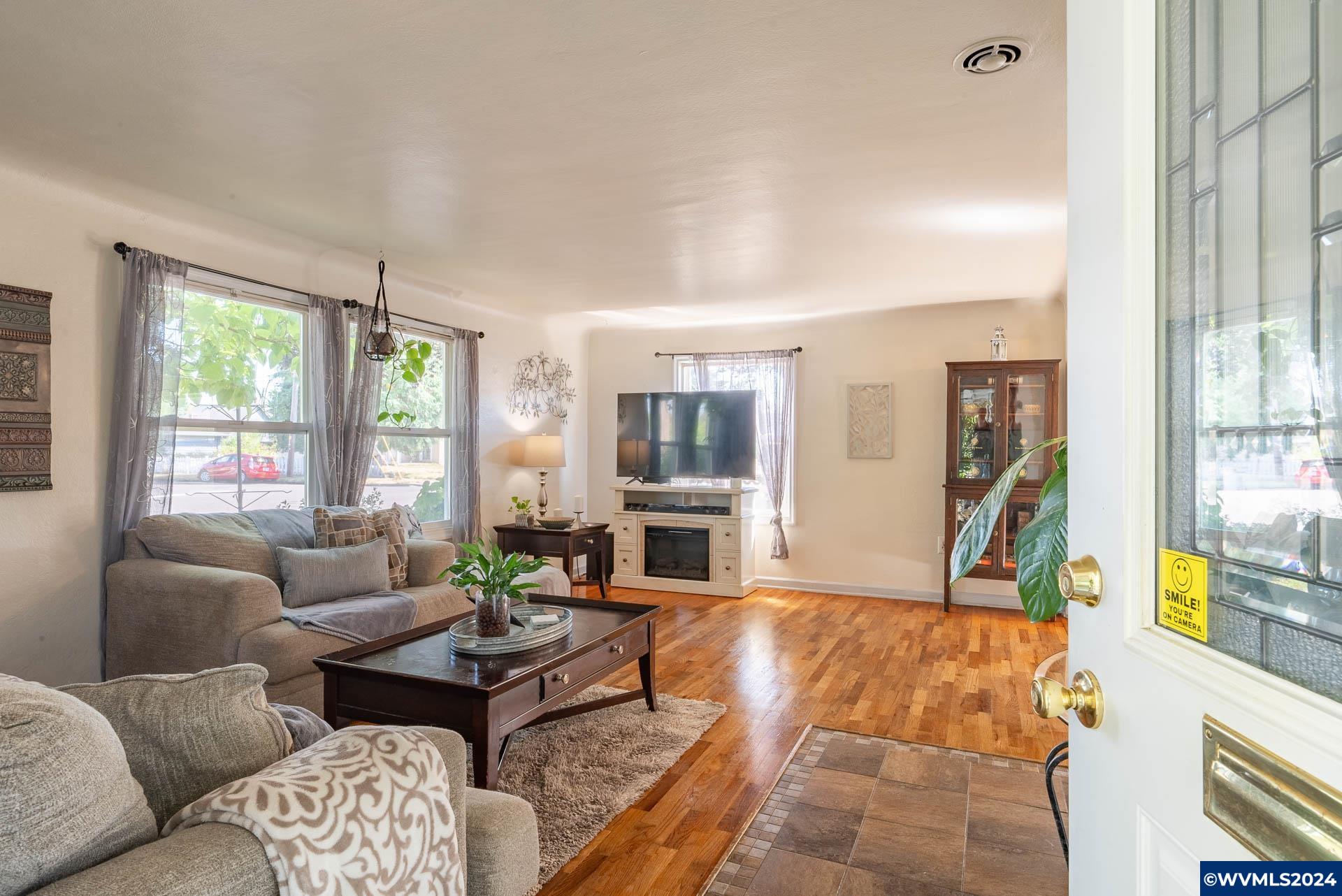 1530 2nd Avenue Albany, OR 97321 - Photo 5 of 35 a living room with furniture and a floor to ceiling window