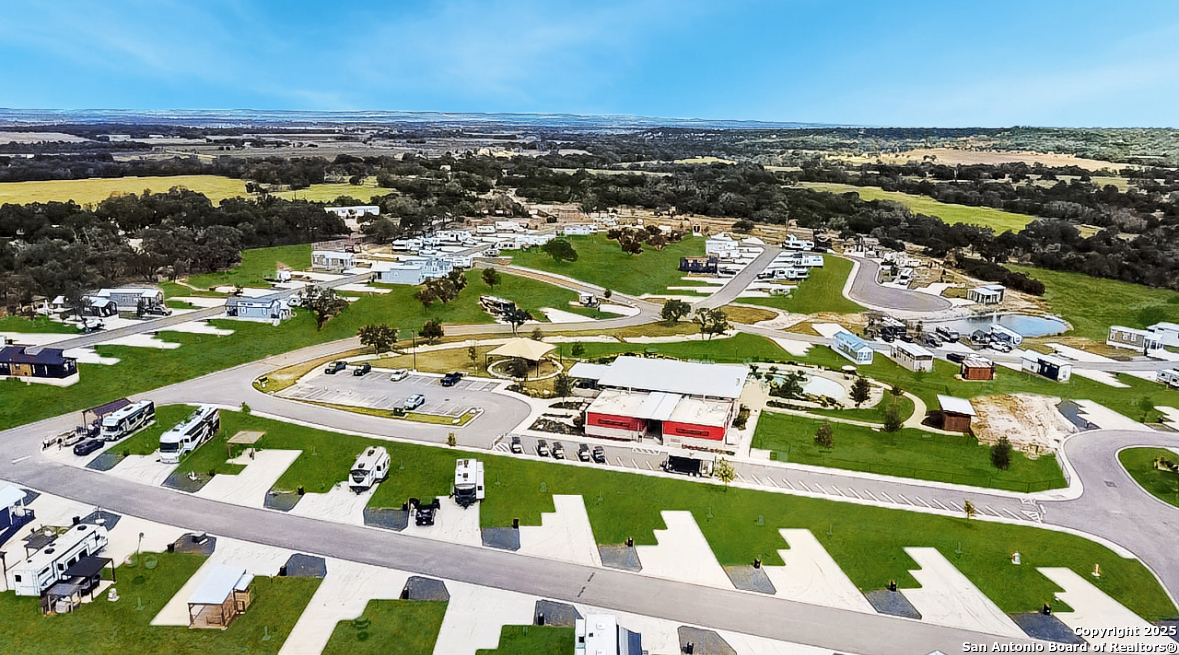 5386 Ranch Road 1376, Unit 232 Fredericksburg, TX 78624 - Photo 4 of 13 an aerial view of residential houses with outdoor space