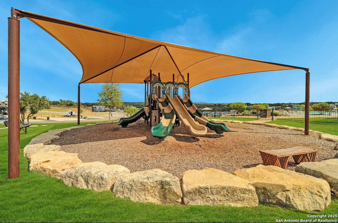 5386 Ranch Road 1376, Unit 232 Fredericksburg, TX 78624 - Photo 6 of 13 a view of an outdoor space and swimming pool